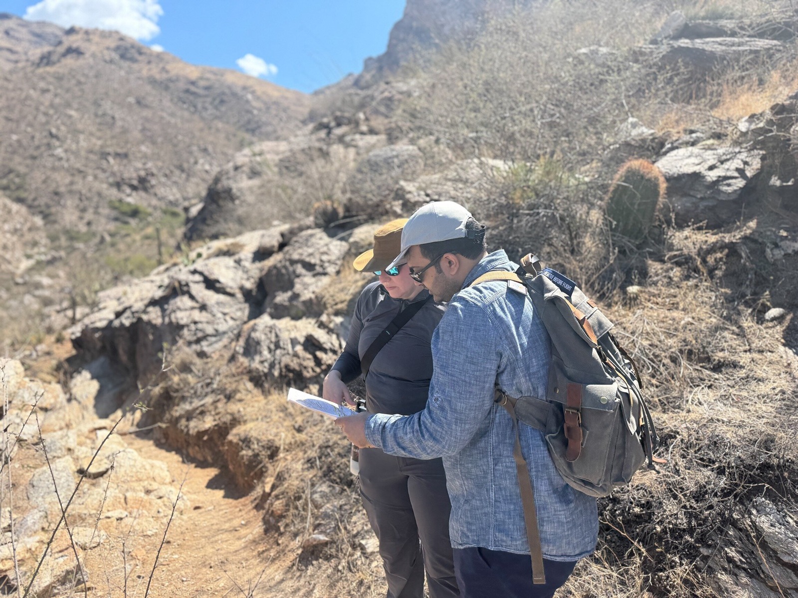 STAR Summit crew in a canyon with field notebooks