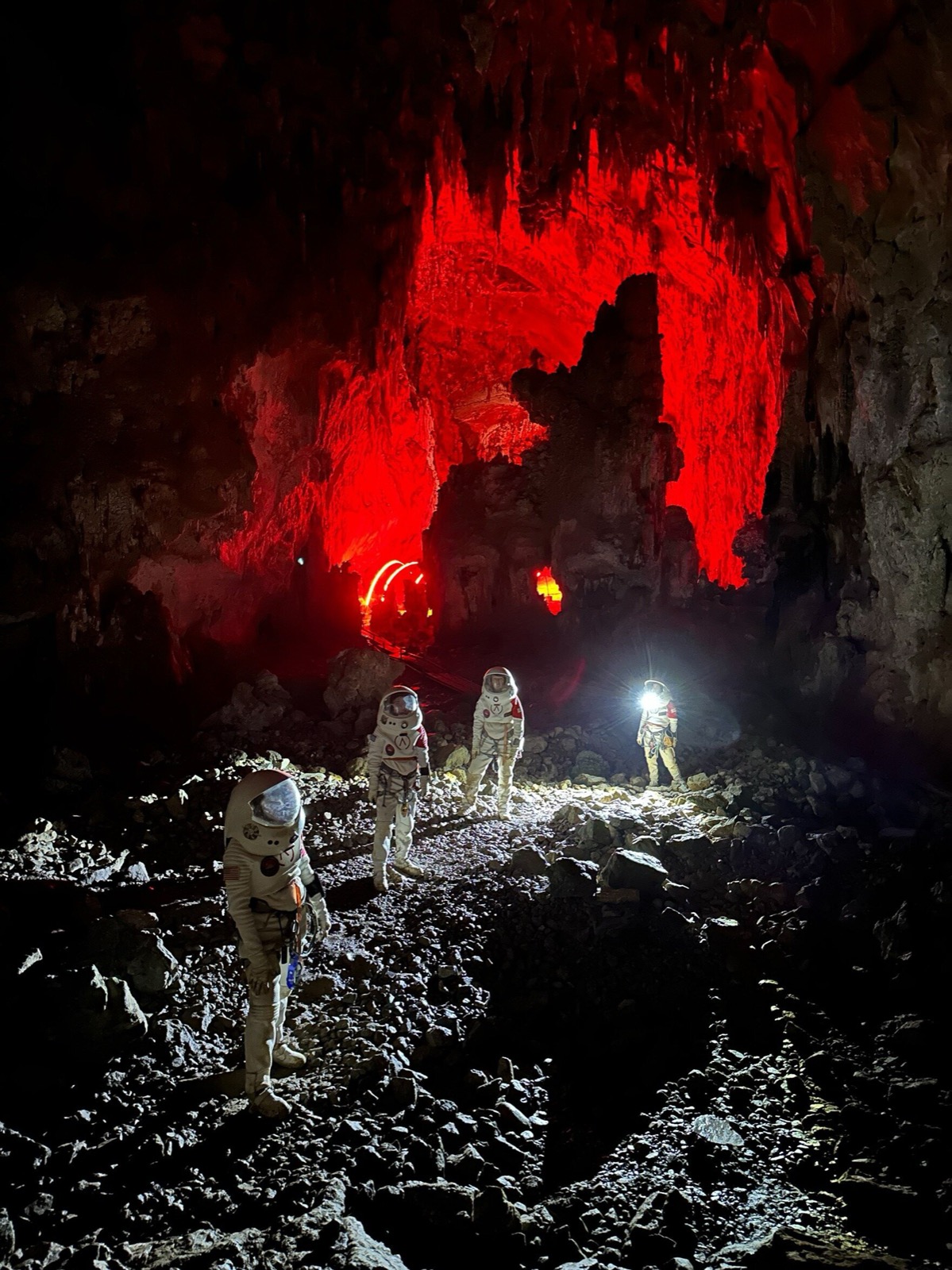 Red-lit cave during an analog mission