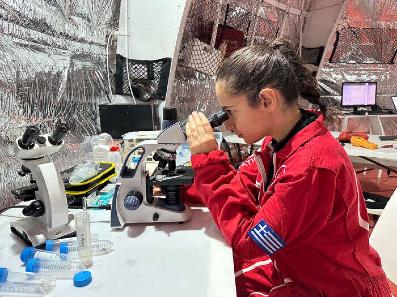 Analog astronaut at a microscope